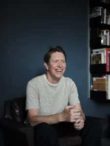 Portrait of actor Sam Spruell laughing