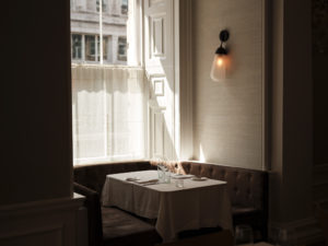 An empty sunlit table in restaurant Spring at Somerset House