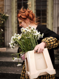 Katie carrying flowers