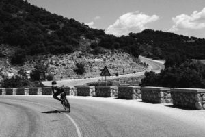 Pedal-Ed sponsored Robin Gemperle leans into a corner in the hills above Meteora