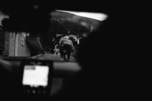Marin Saint Exupery as seen through the windscreen of control car one climbing into Livigno on the ninth Transcontinental race