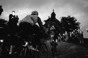 Transcontinental riders climb the cobbled Muur out of Geraardsbergen to begin their race across Europe