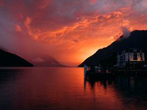 Storm clouds move in as the sun sets over Lake Lucerne